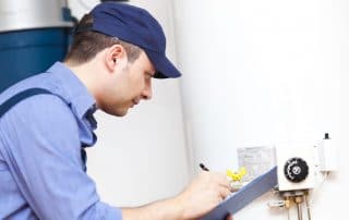 Technician repairing an hot-water heater