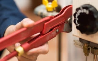 Plumber working on a water heater