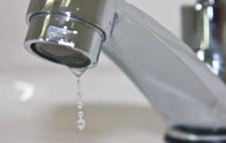 Leaking faucet in a bathroom
