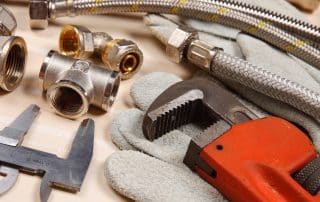 Set of plumbing tools on a table