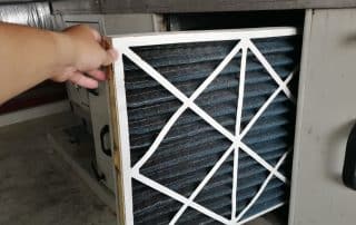 Technician checking a Pre-filter of air handling unit for replacement a new filter
