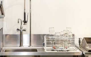 Commercial Kitchen Sink With Sprayer Faucet in Restaurant